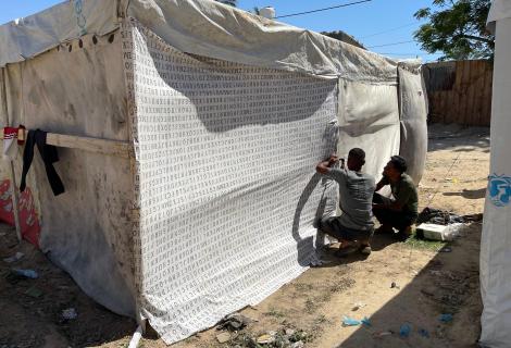 Displaced Palestinians, evacuated from Rafah