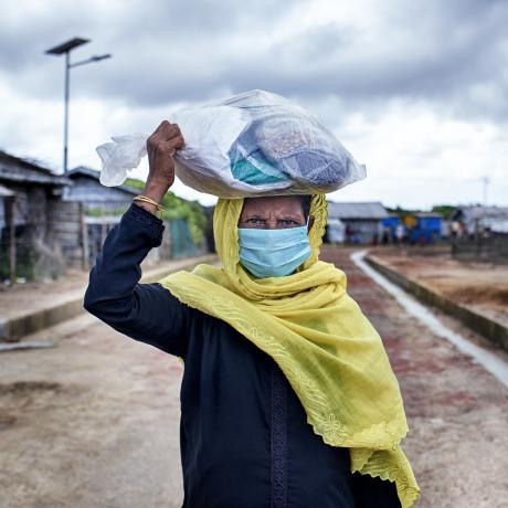 Gul, 65, carries a bag of seeds she collected from ActionAid Bangladesh’s woman-friendly space in the Rohingya refugee camp at Cox’s Bazar.